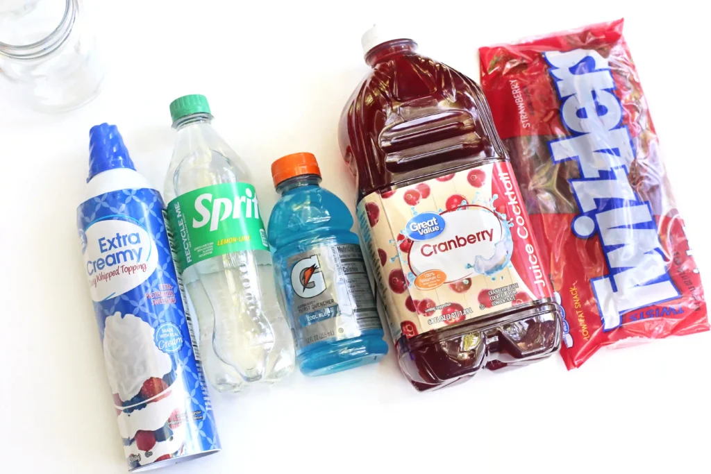 ingredients for the Patriotic Red, White, and Blue Drink- sprite, whipped cream, gatorade, cranberry juice, and twizzlers