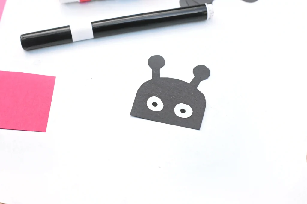 a ladybug head cut out of black construction paper