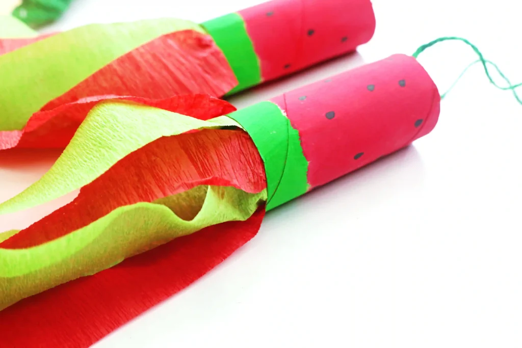 watermelon windsocks made of painted toilet paper rolls with streamers