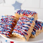 rice krispie treats with red, white, and blue chocolate and sprinkles on top