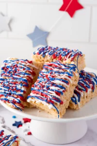 rice krispie treats with red, white, and blue chocolate and sprinkles on top