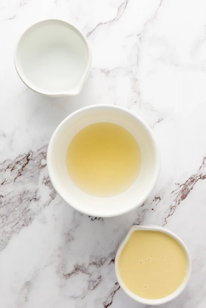 gelatin in a white bowl on a marbled surface for these patriotic jello cups