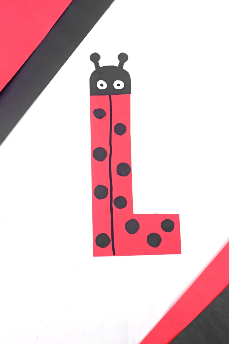 construction paper cut to look like the letter l and decorated like a ladybug