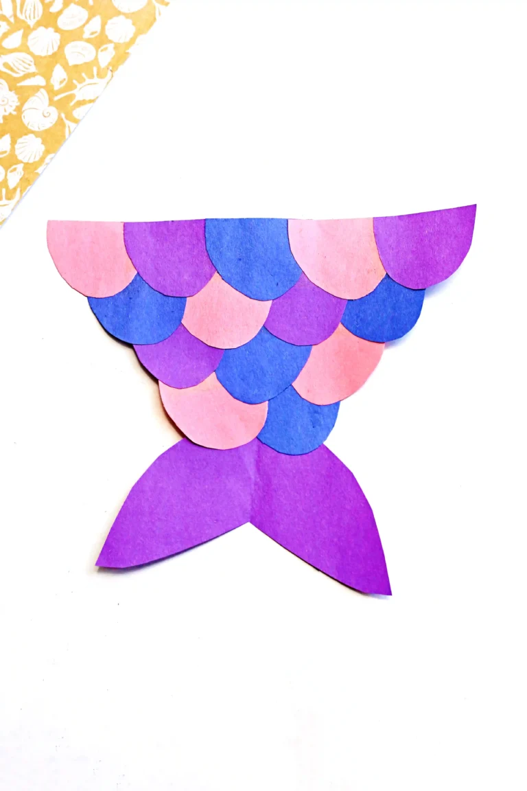a mermaid tail craft made out of pink, purple, and blue construction paper