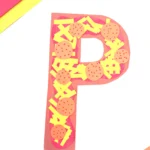 a letter p craft that is decorated to look like pizza