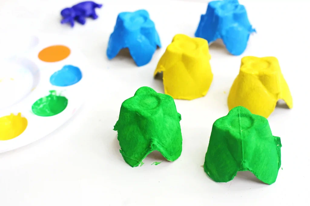 egg carton cups painted green, yellow, and blue