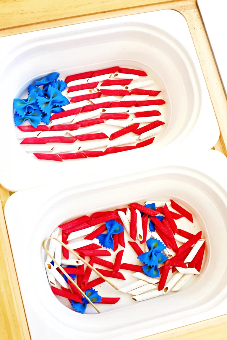 Assorted tricolor pasta (red and white tubes) with blue bow-tie pasta in a white container next to a container with the pasta arranged as an american flag