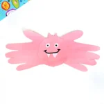 a pink bat handprint craft made out of pink construction paper with a drawn on face