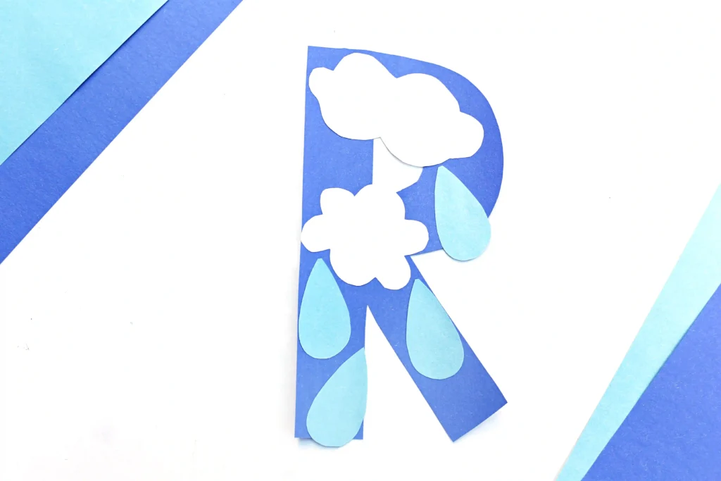 weather craft for kids that has a letter R cut out of blue construction paper with rain drops and clouds