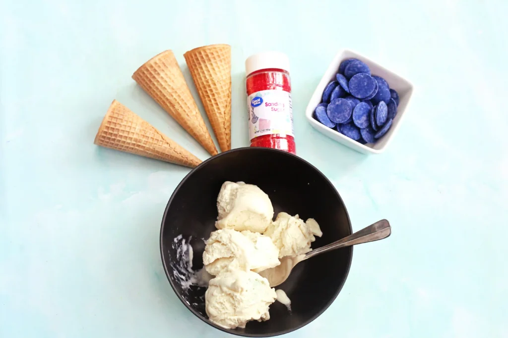 supplies for the Red, White, and Blue Ice Cream Cones - ice cream comes, red sanding sugar, blue candy melts, and vanilla ice cream