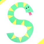 a letter s craft of a green S cut out of construction paper decorated to look like a snake with yellow scales and a red tongue