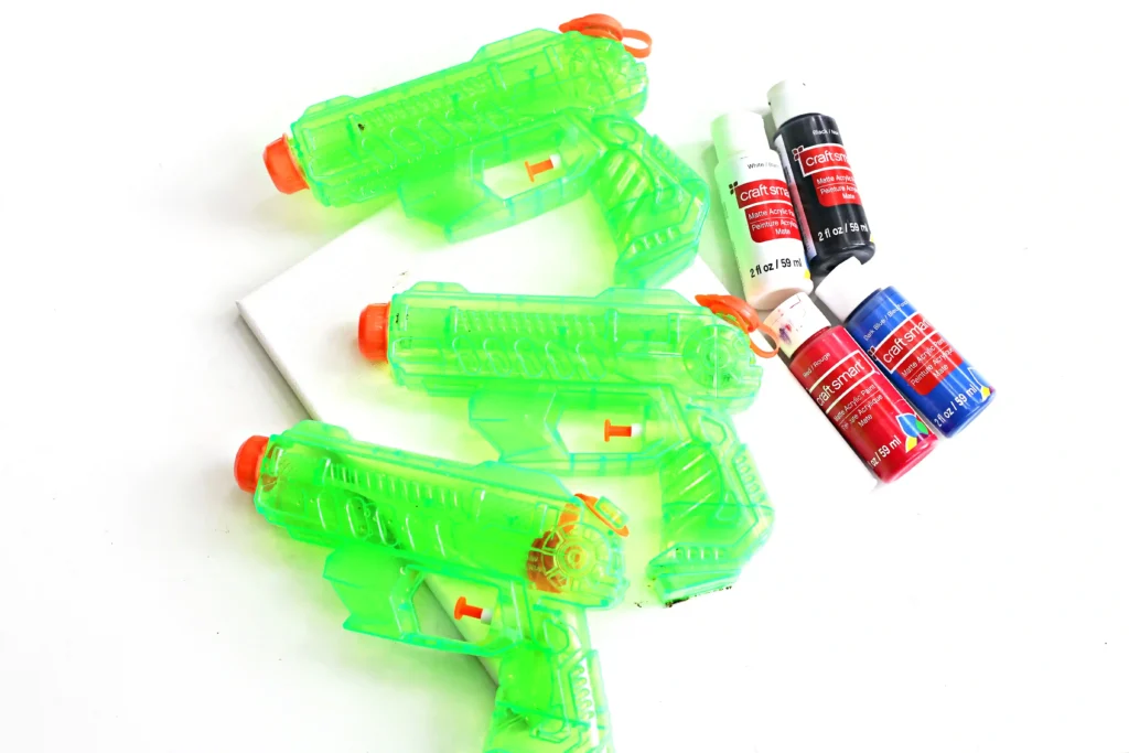 canvas, paint, and squirt guns