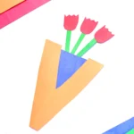 a preschool letter v vase activity craft made out of construction paper with paper roses inside