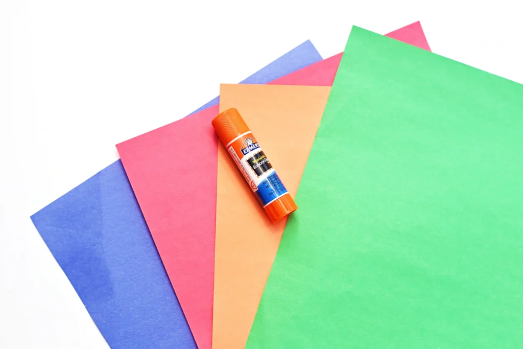 supplies for this v is for vase paper craft - red, green, blue and orange construction paper and a glue stick