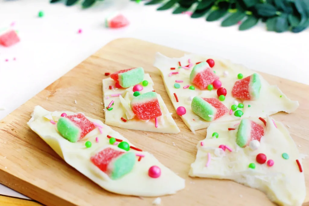 watermelon chocolate bark that is white chocolate with watermelon gummies and watermelon-themed sprinkles
