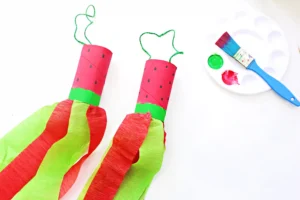 a watermelon windsock that has a toilet paper roll painted like toa watermelon and red and green streamers