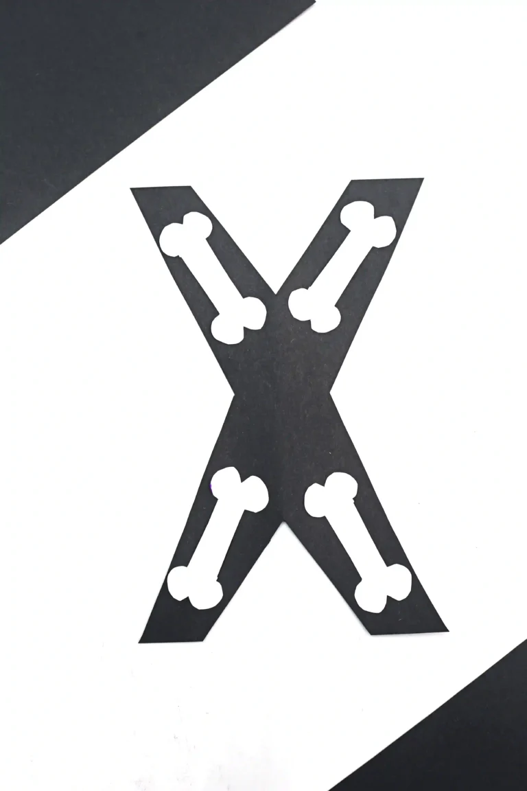 a letter x craft that has a black x with white bones to look like an x-ray