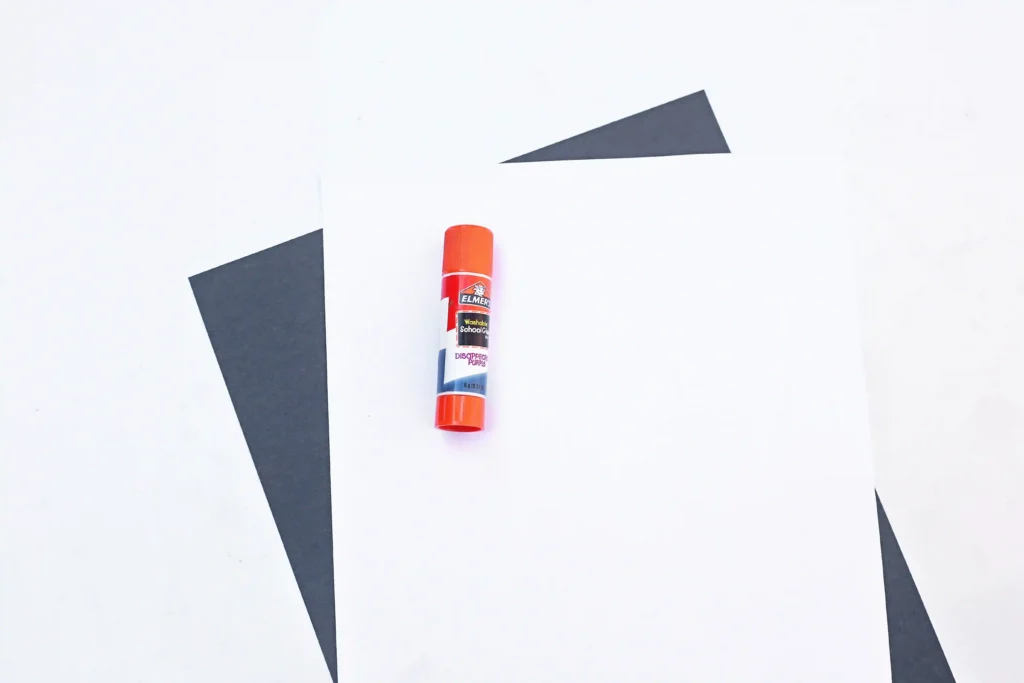 supplies for this x is for x-ray paper craft - white and black construction paper and a glue stick