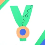 a letter y craft that has a letter y cut out of green construction paper and a construction paper yoyo attached