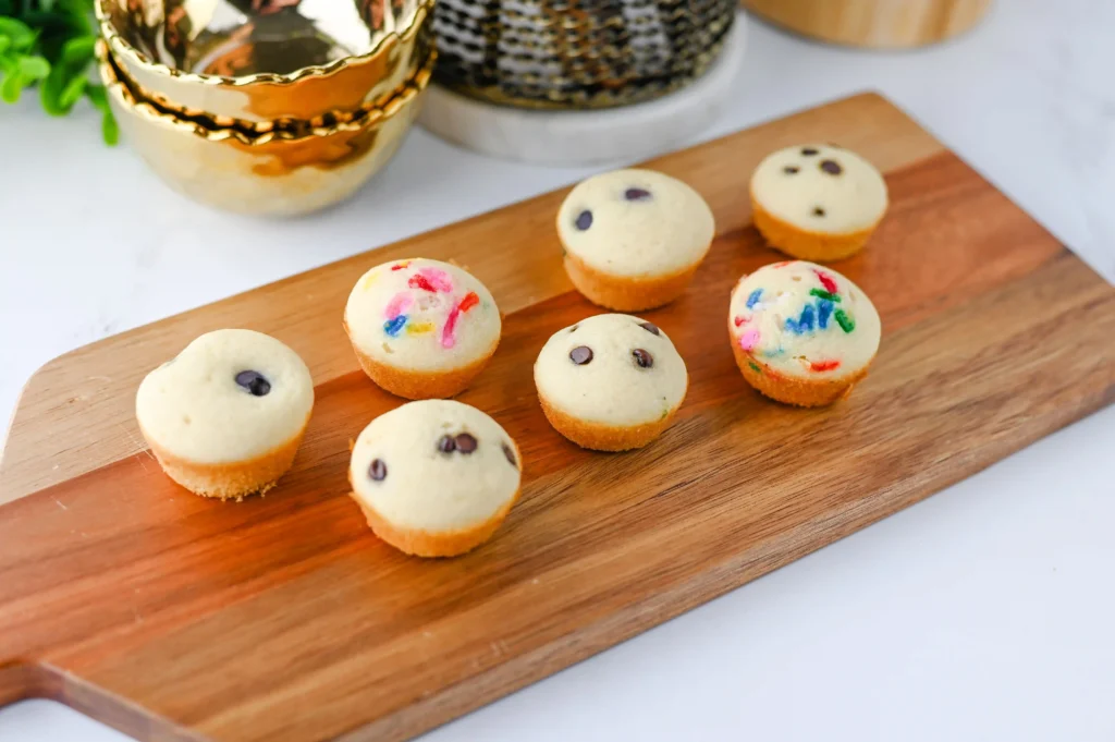 Pancake Bites with chocolate chips and sprinkles on a wooden board