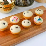 Pancake Bites with chocolate chips and sprinkles on a wooden board