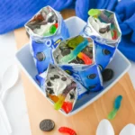 walking dirt cups in mini oreo bags iwth chocolate pudding and gummy worms inside