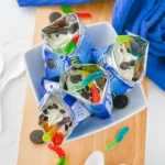 walking dirt cups in mini oreo bags iwth chocolate pudding and gummy worms inside