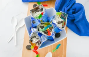 walking dirt cups in mini oreo bags iwth chocolate pudding and gummy worms inside