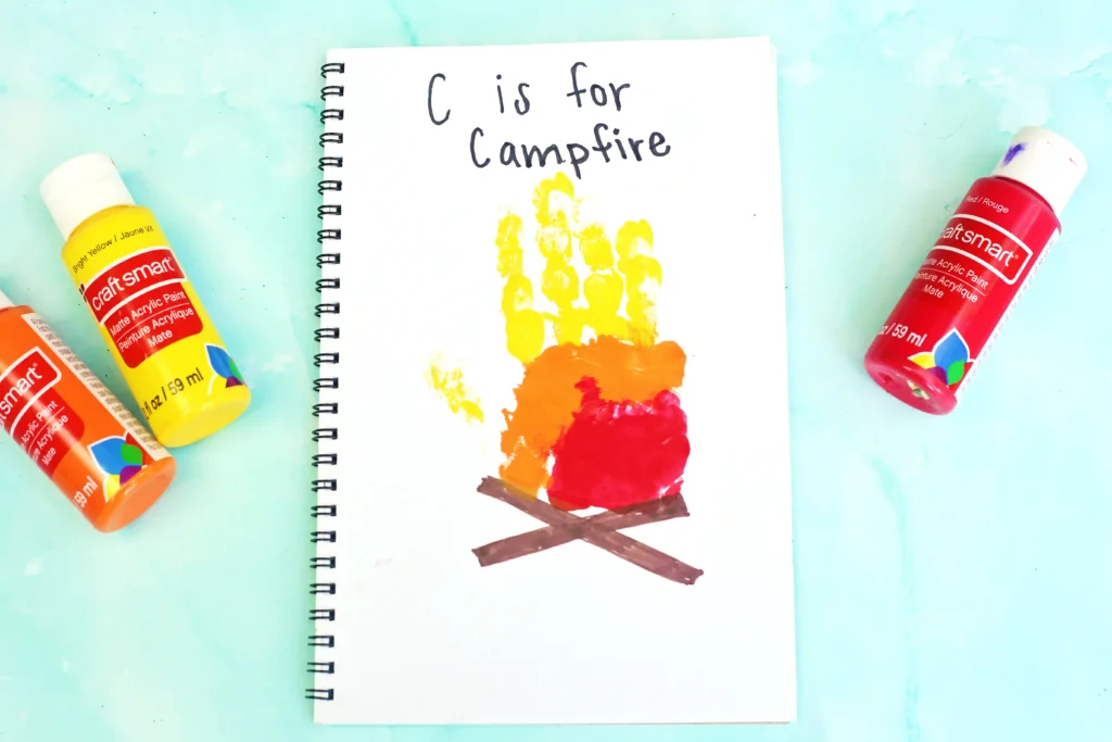 a letter c handprint craft that looks like a campfire