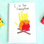 a letter c handprint craft that looks like a campfire