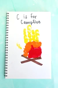 a letter c handprint craft that looks like a campfire