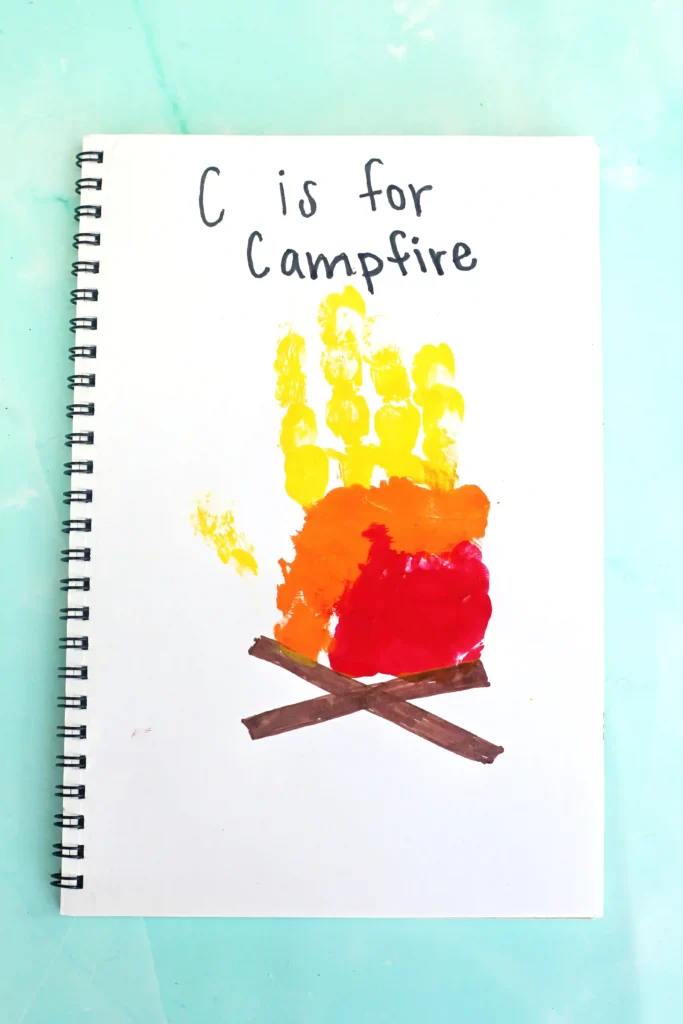 a letter c handprint craft that looks like a campfire