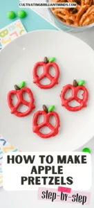 Apple Pretzels that are bow pretzels covered in red melting chocolate with a brown and green M&M for the stem and leaf