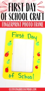 a First Day of School Photo Frame that is painted yellow with fingerprint apples and words that read "first day of school"