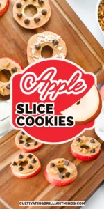 Apple Slice Cookies with peanut butter, chocolate chips, and coconut flakes on a wooden board