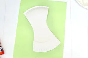 a paper plate cut into the shape of an apple core