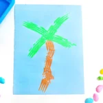 a Fork Painted Palm Tree on blue paper