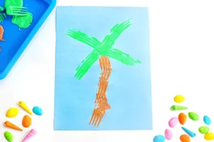 a Fork Painted Palm Tree on blue paper