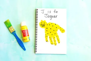a letter J handprint craft that is decorated to look like a jaguar