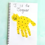 a letter J handprint craft that is decorated to look like a jaguar