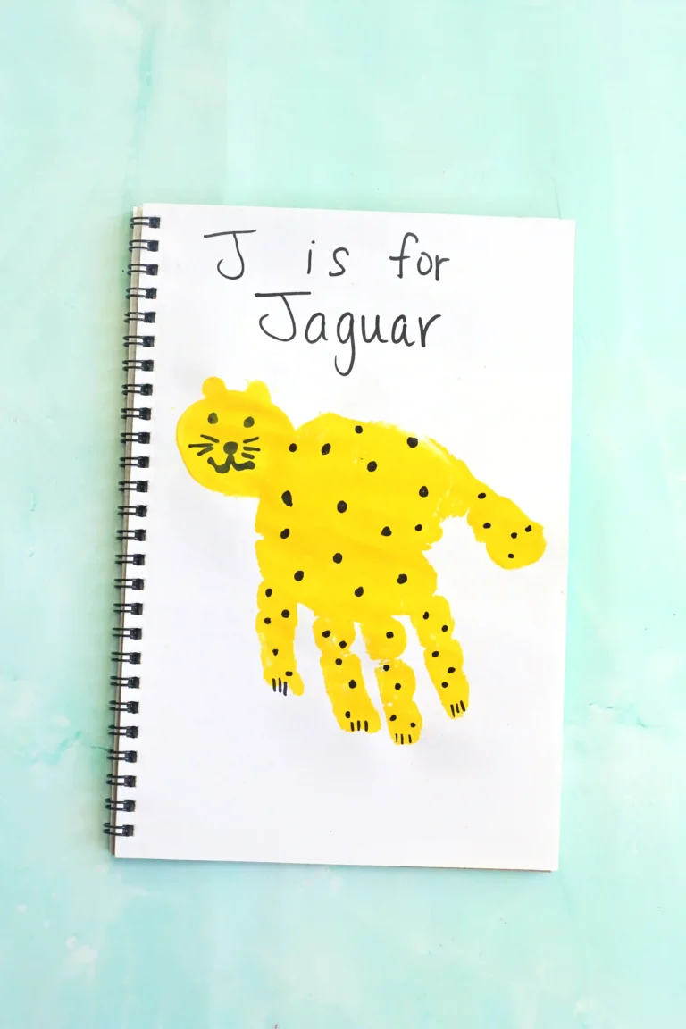 a letter J handprint craft that is decorated to look like a jaguar