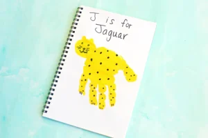 a letter J handprint craft that is decorated to look like a jaguar
