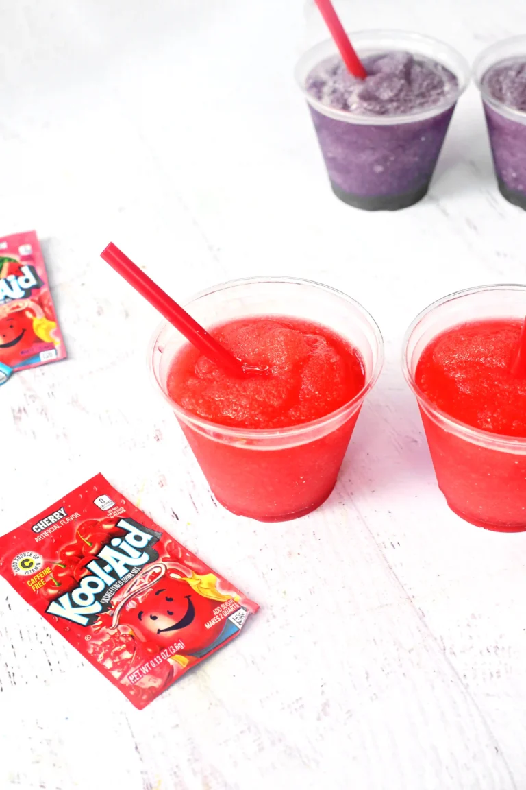 a Kool-Aid Slushie in a clear cup with a red straw