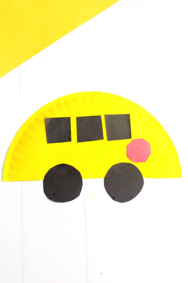a paper plate school bus craft that is a paper plate cut in half, and painted yellow with construction paper windows, stop sign, and wheels