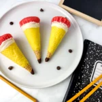 Pencil Ice Cream Cone Cupcakes that have a waffle cone stuffed with cupcakes and decorated to look like a pencil