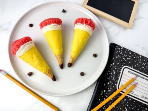 Pencil Ice Cream Cone Cupcakes that have a waffle cone stuffed with cupcakes and decorated to look like a pencil