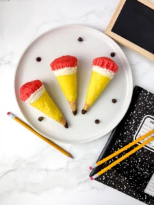 Pencil Ice Cream Cone Cupcakes that have a waffle cone stuffed with cupcakes and decorated to look like a pencil
