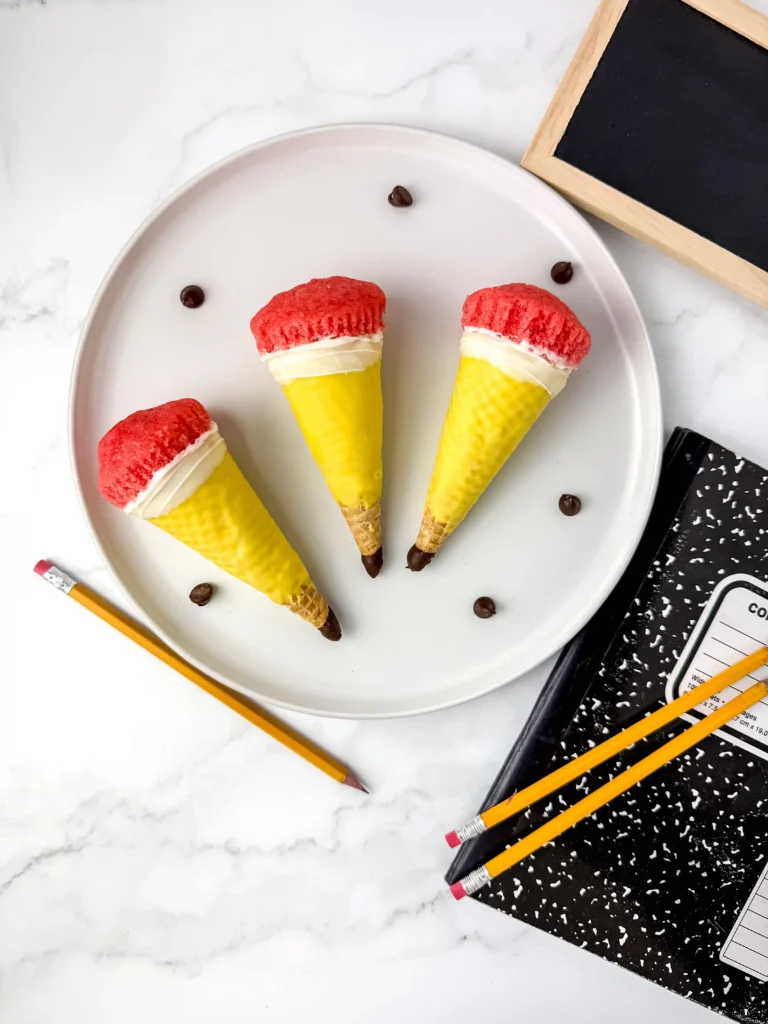 Pencil Ice Cream Cone Cupcakes that have a waffle cone stuffed with cupcakes and decorated to look like a pencil