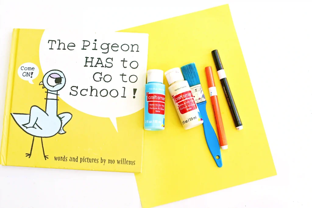 supplies for this mo willems craft - yellow construction paper, blue and white paint, black and orange markers, a paintbrush, and the book "The Pigeon HAS To Go To School"