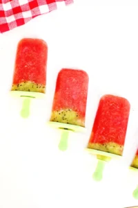 watermelon kiwi popsicles on green popsicle sticks